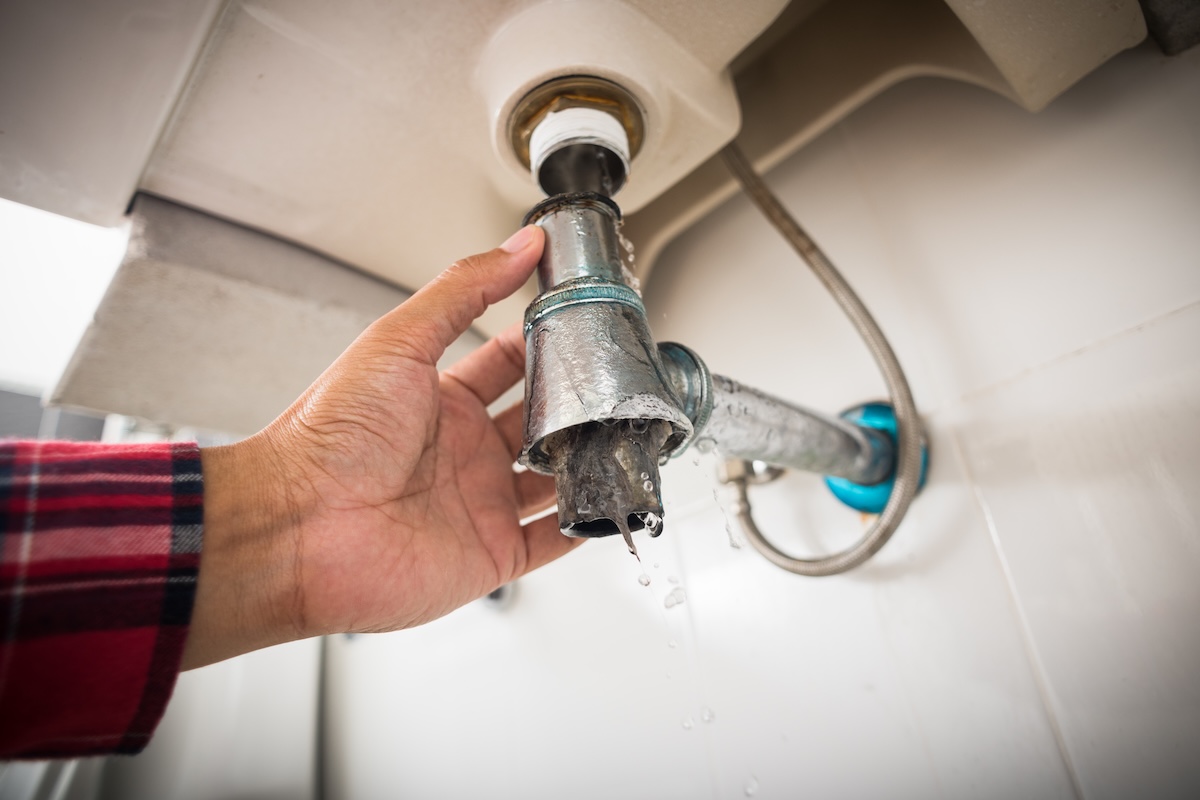 Repairing clogged and leaky washbasin sewer in the bathroom