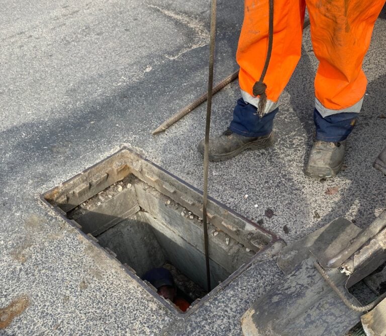 Cleaning storm drains from debris, clogged drainage systems are cleaned with a pump and water